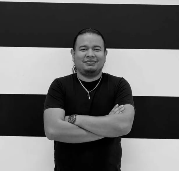 Caleb Elizondo, founder of Get It Ready, standing with his arms crossed